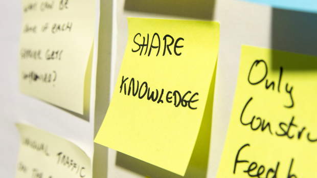 Post-it note saying Share knowledge